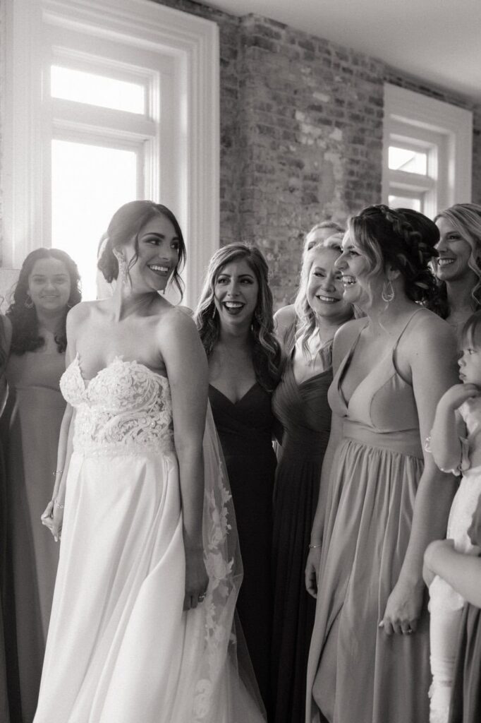 bride and her friends sharing a sweet moment at the cordelle in nashville