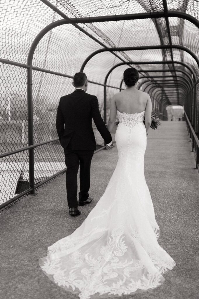 couple walking along a bridge in nashville