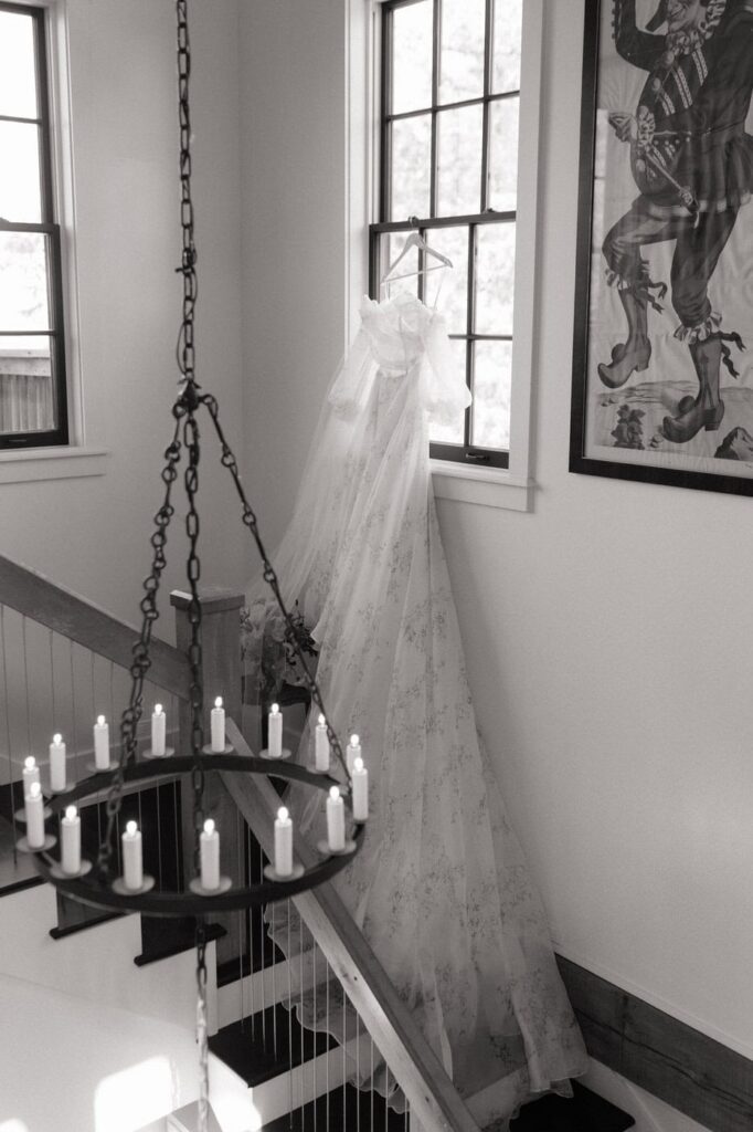 brides dress hanging in the window at wedding venue in nashville