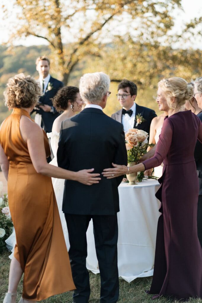 bride and grooms parents standing with them at their wedding ceremony in nashville