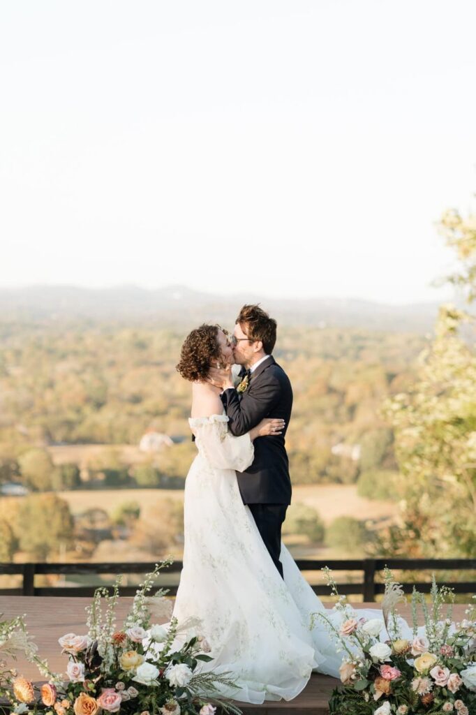 bride and groom first kiss at trinity view farm in franklin tennessee