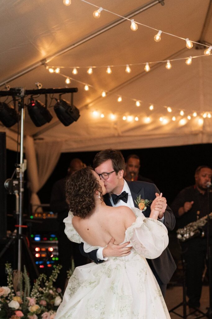 bride and groom kissing during first dance
