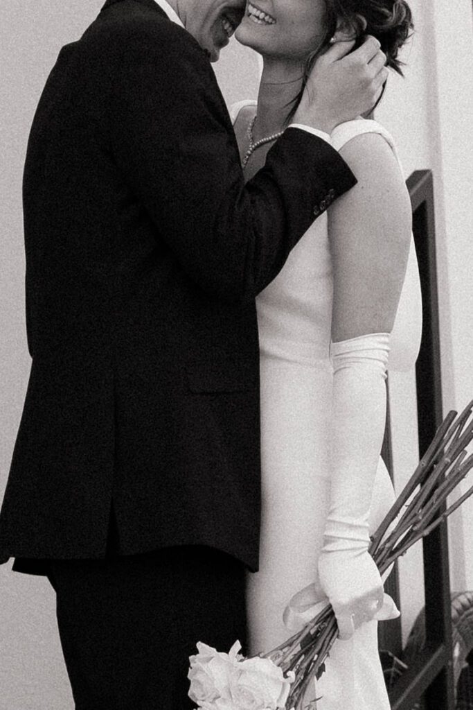 close up of couple laughing on their wedding day