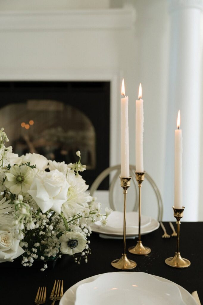 Gold flatware and white florals at The Dimora
