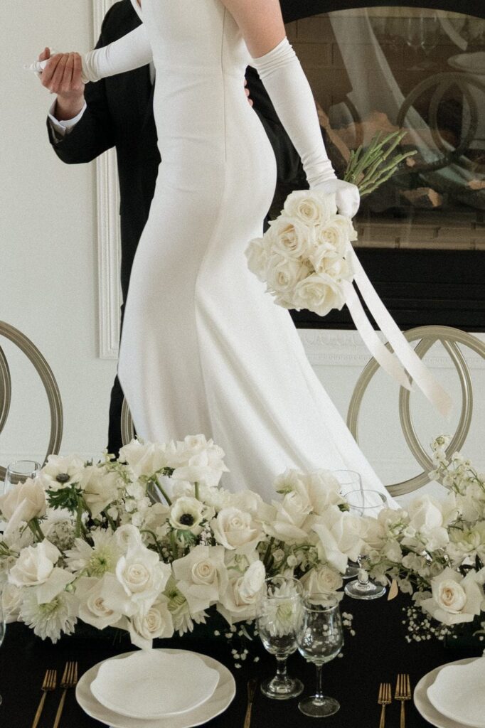 Bride and groom by fireplace at The Dimora Italian inspired estate