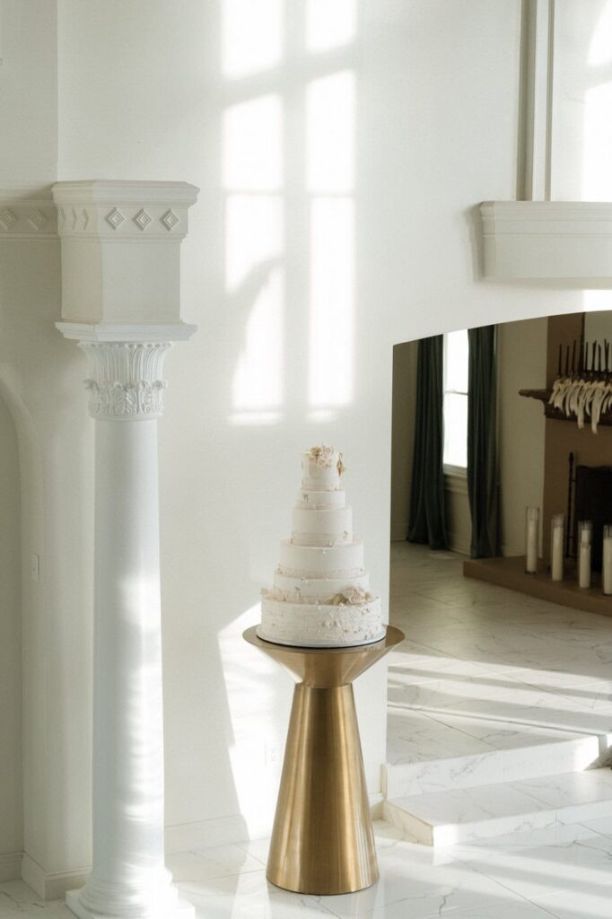 wedding cake standing in the reception hall at winter wedding