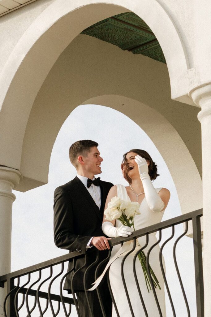 candid moment of couple laughing at their winter wedding at the dimora