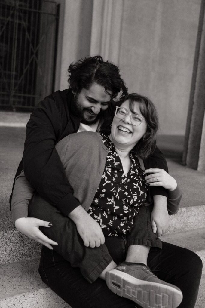 couple laughing at nashville engagement session in centennial park