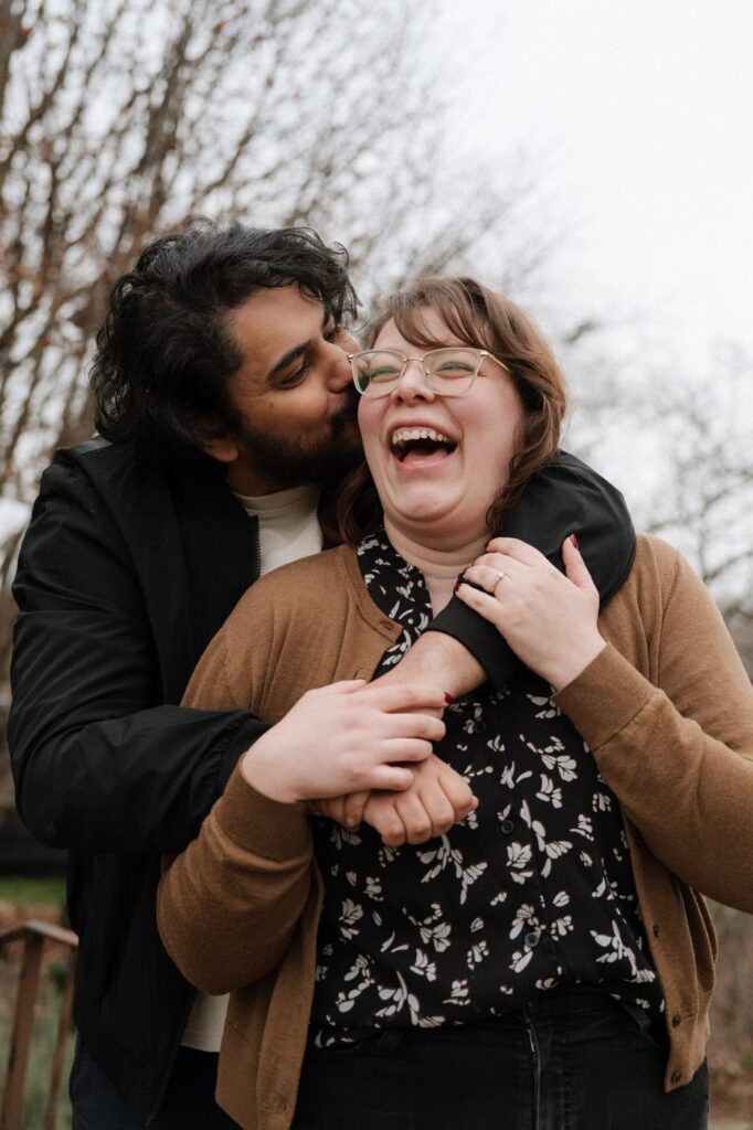 couple embracing and laughing during nashville engagement session