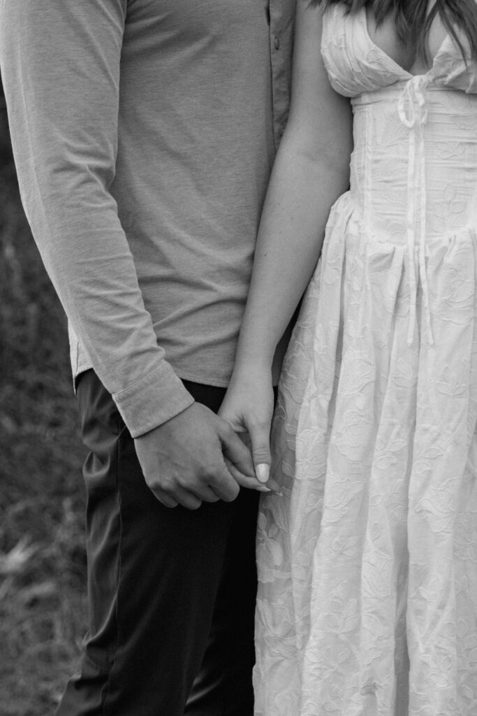 close up of couples hands during engagement session