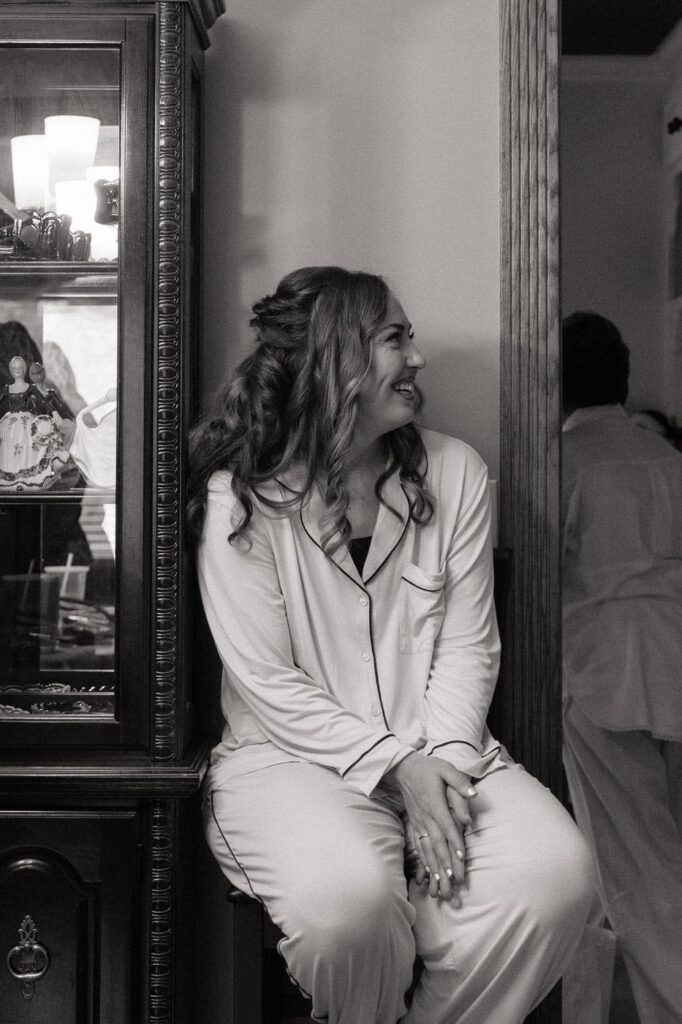bridal party laughing during getting ready portion of the wedding day in nashville