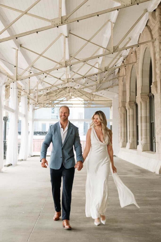 couple in complementary outfits during engagement session Nashville