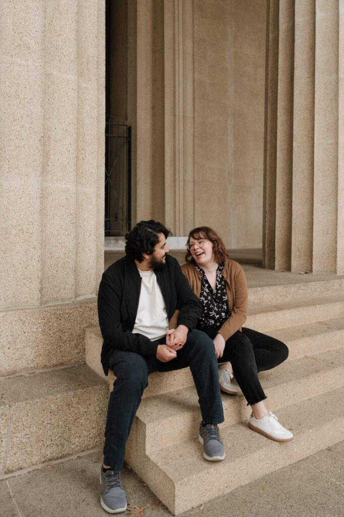 couple laughing during engagement session in nashville