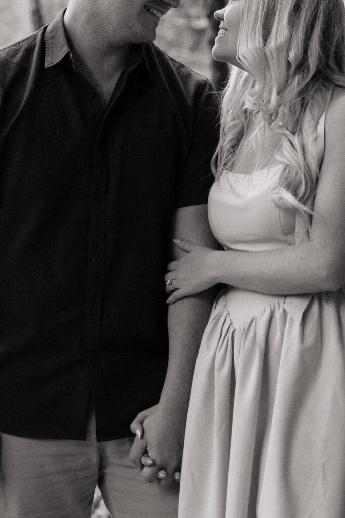couple smiling and sharing a sweet moment during engagement session in tennessee