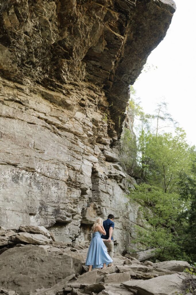 couple hiking up the rocks at the state park in tennessee