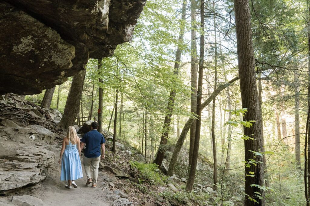 wide shot of couple walking through fall creek falls state park