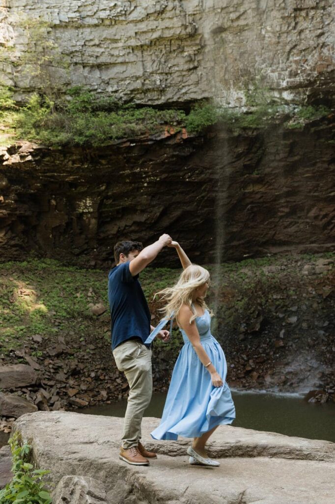 couple dancing at fall creek falls in the spring