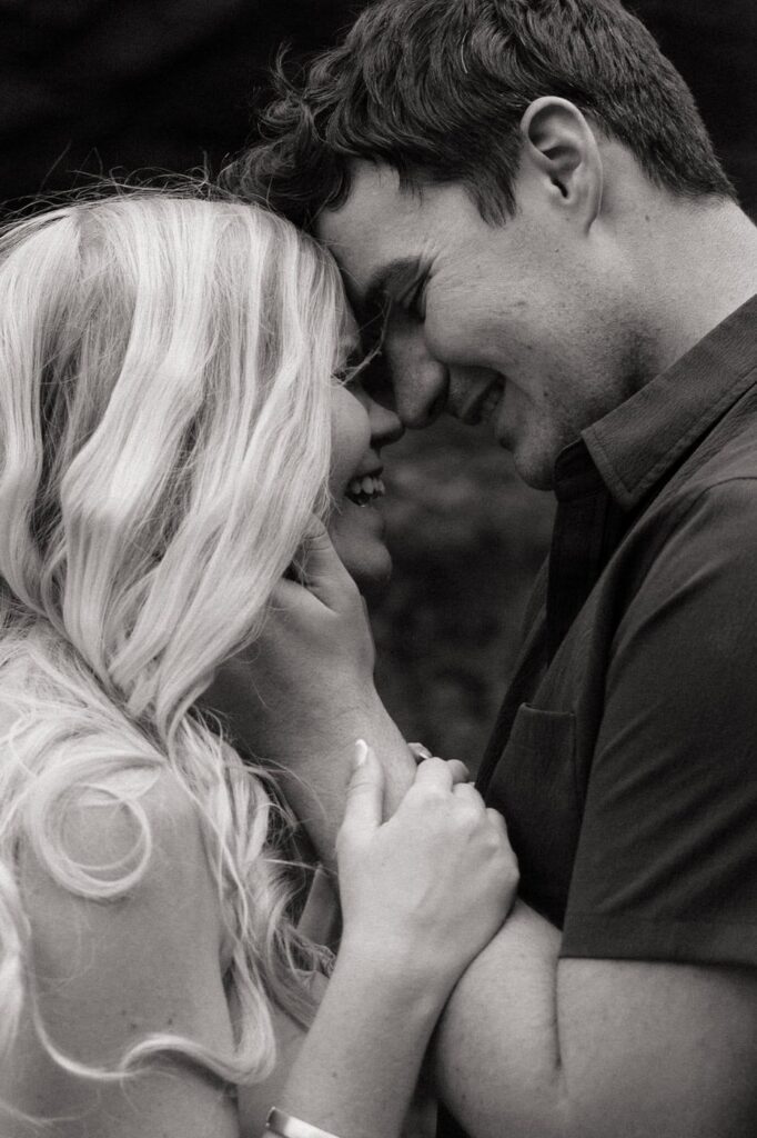 couple sharing a sweet candid moment during engagement photos