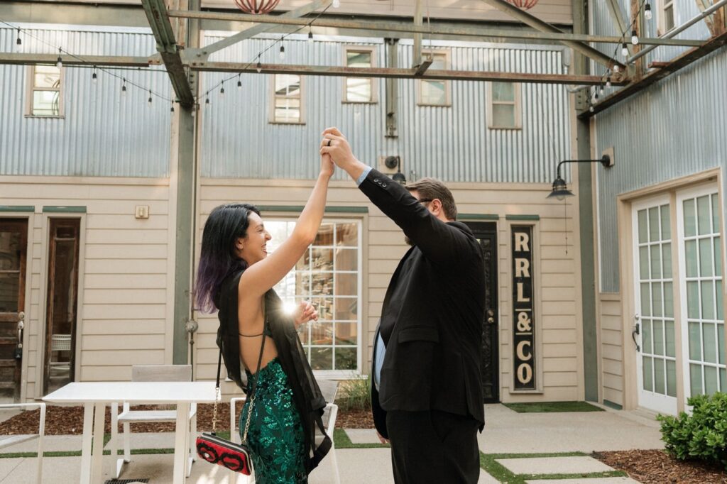 couple dancing and laughing during engagement session in nashville