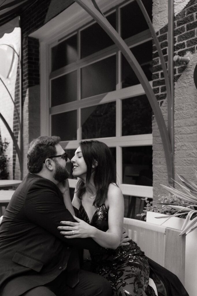 couple sharing an intimate moment during midtown nashville engagement session
