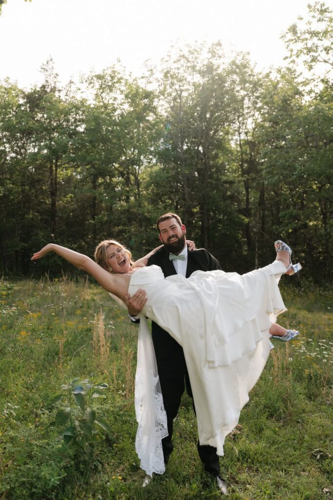 groom holding up his bride on wedding day at nashville wedding venue
