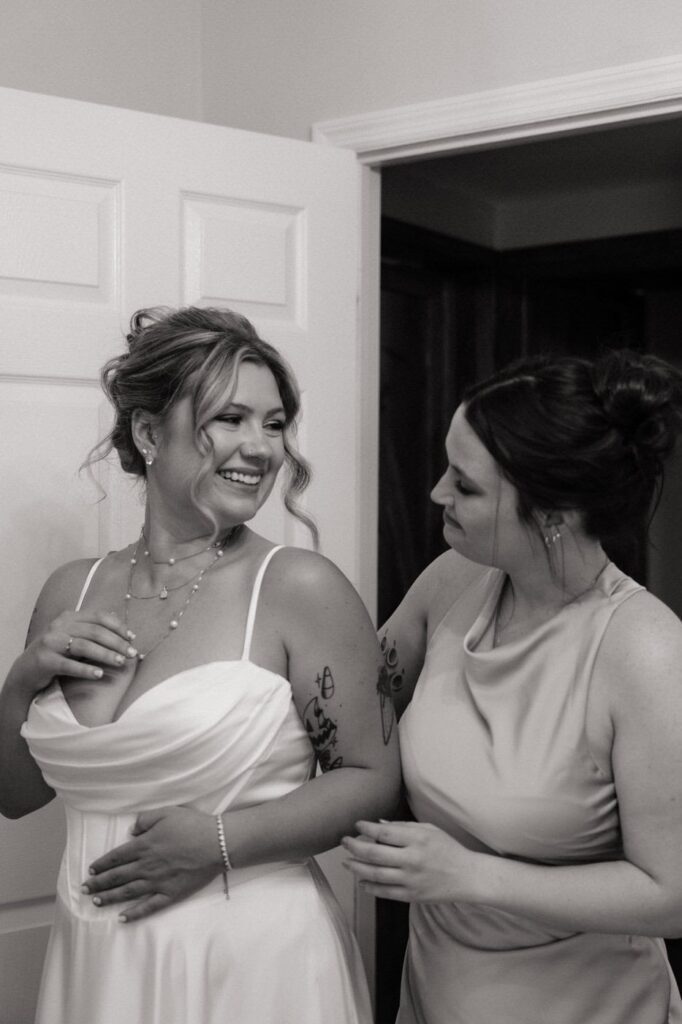 bride and maid of honor getting ready at stone gate farm wedding in nashville