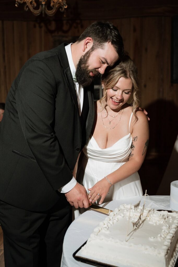 couple cutting their wedding cake at stone gate farm in nashville tennessee