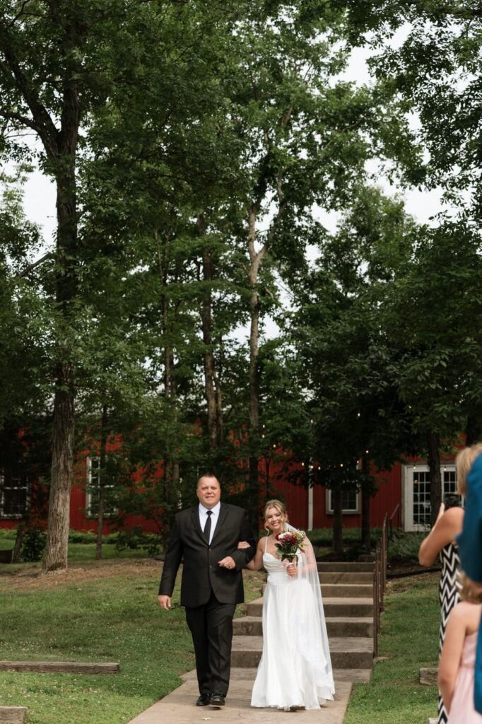 bride and her father walking down the aisle at stone gate farm wedding in nashville tennessee