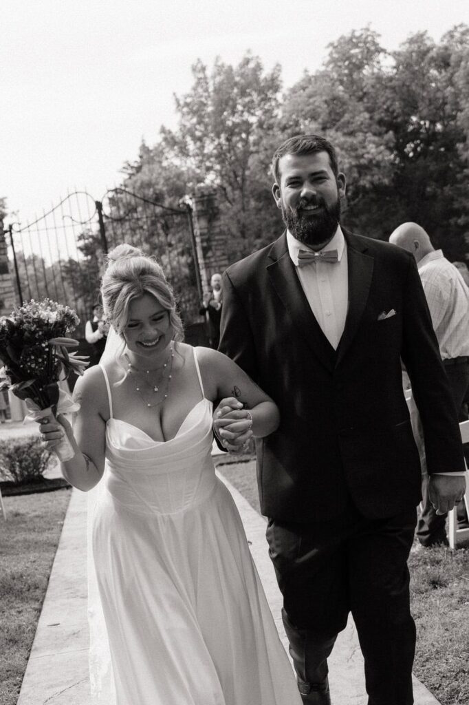 couple laughing during their exit after wedding ceremony at stone gate farm in nashville