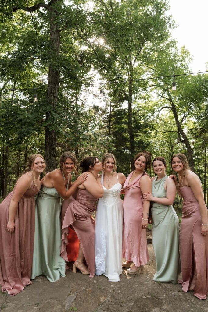 bride and bridesmaids posing at stone gate farm wedding in nashville