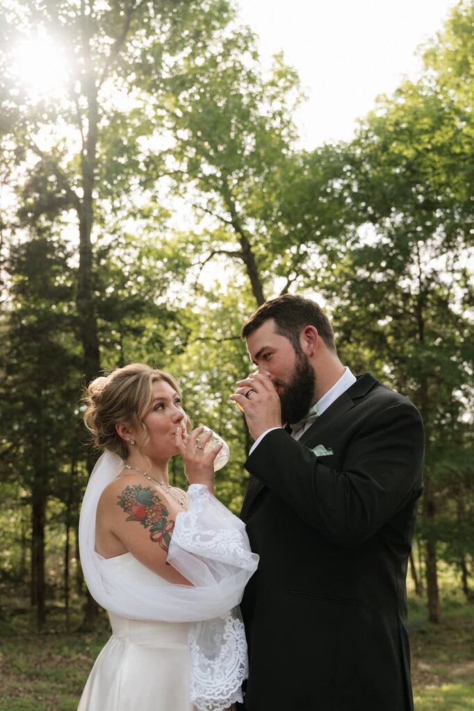 couple sipping their signature cocktails at their stone gate farm wedding in nashville