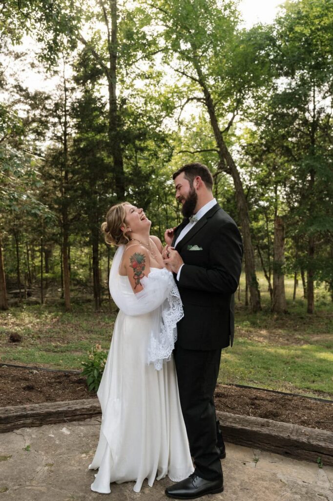 couple laughing during portraits after ceremony at nashville wedding