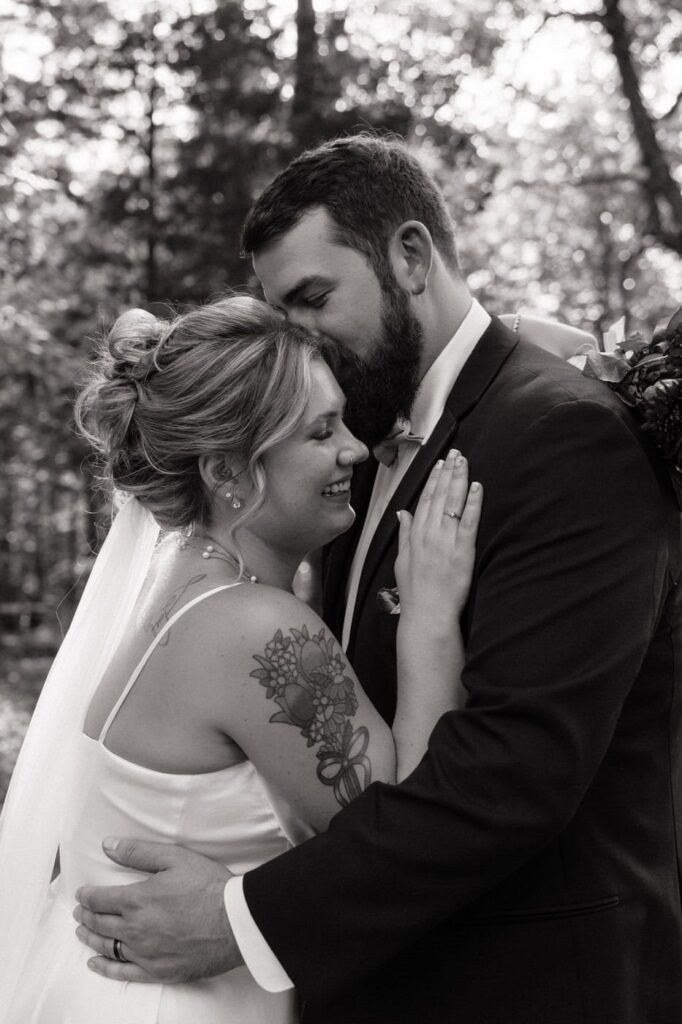 bride and groom embracing during a sweet moment after their wedding ceremony