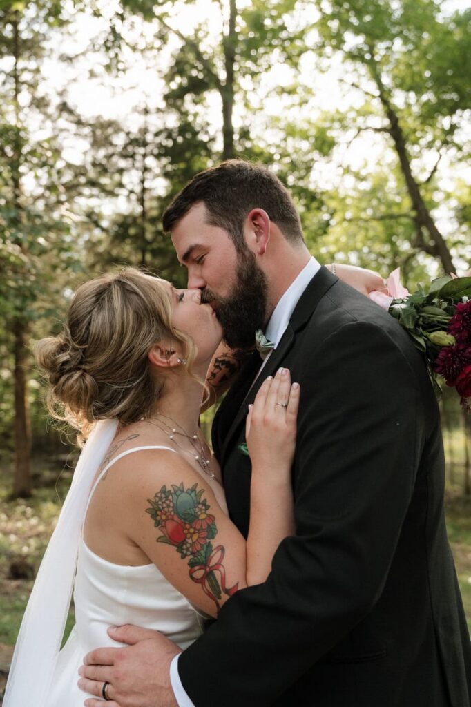 bride and groom kissing during newlywed portraits at nashville wedding