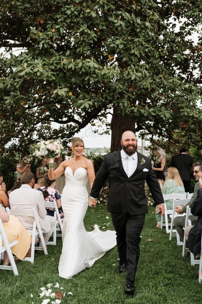 bride and groom walking back down the aisle after spring wedding ceremony