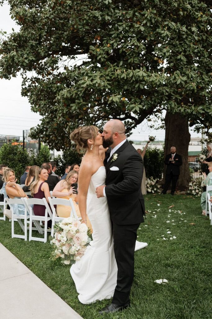 bride and groom sharing a kiss after their spring wedding at the estelle in nashville