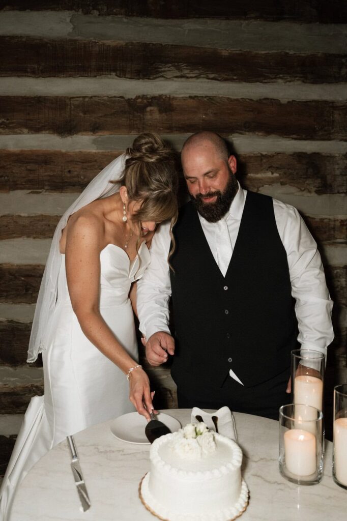 bride and groom cutting their wedding cake at the estelle in nashville