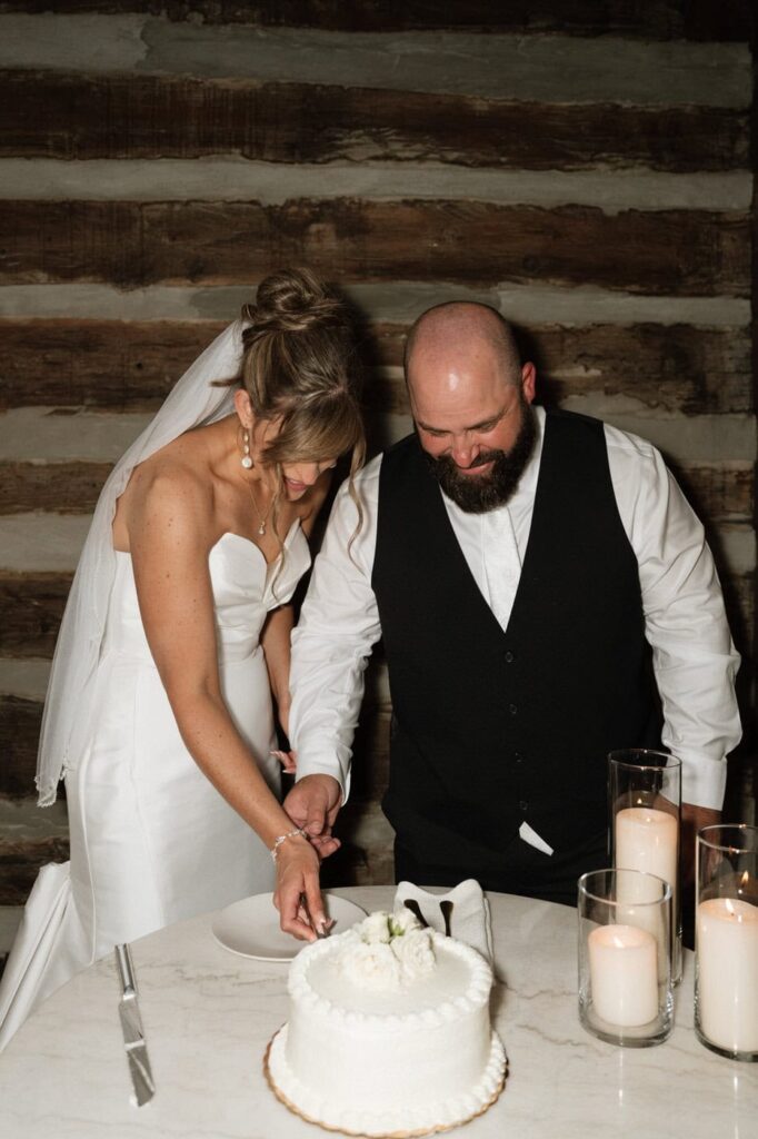 nashville wedding photographer documents couple cutting their cake