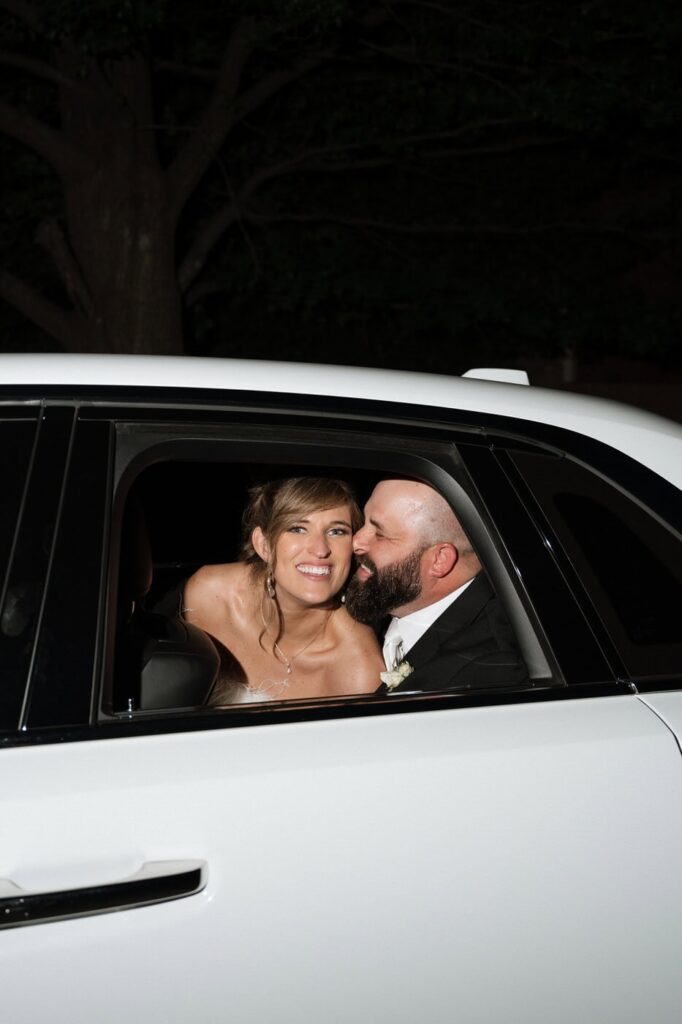 bride and groom in the rolls royce getaway car in nashville