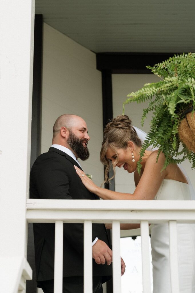bride and groom first look on the front porch at the estelle in nashville