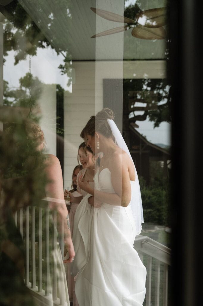 photo of bride through the window