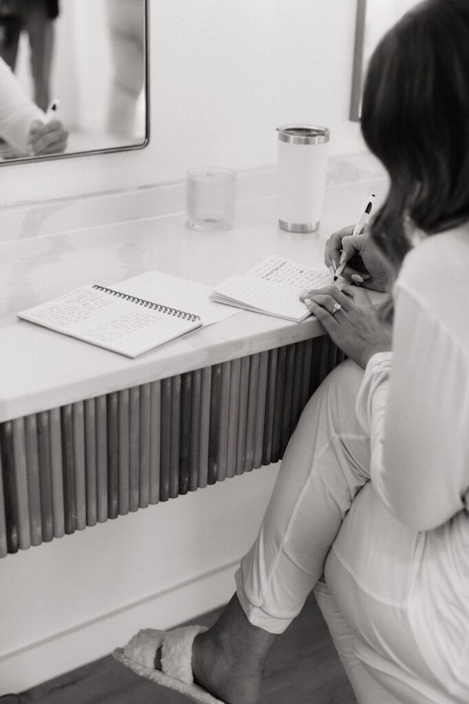 bride writing her vows the morning of her wedding