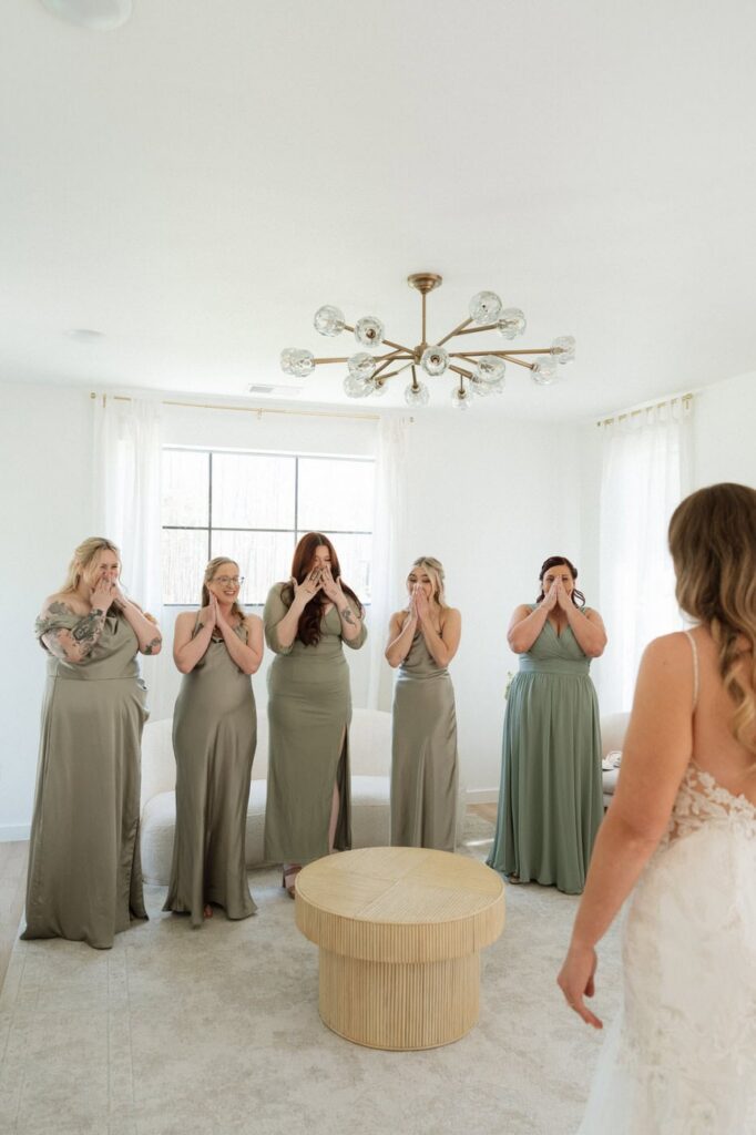 brides first look with her bridesmaids at nashville wedding