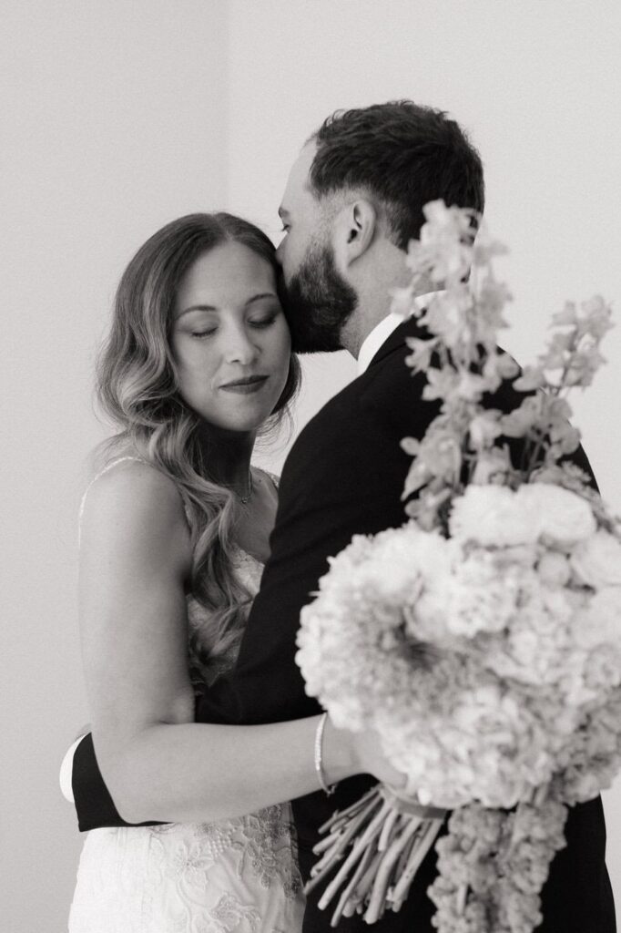 bride and groom sharing a private moment after the first look