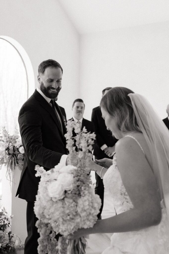 groom helping the bride up the stairs at nashville wedding