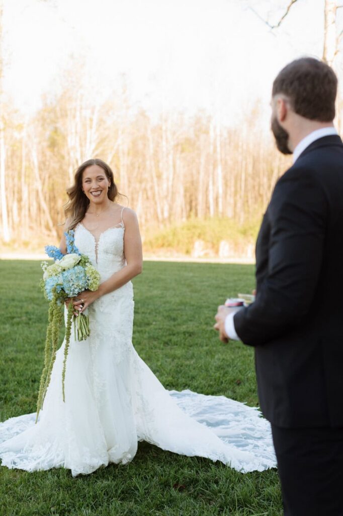 bride smiling at the groom during bridal photos at nashville spring wedding