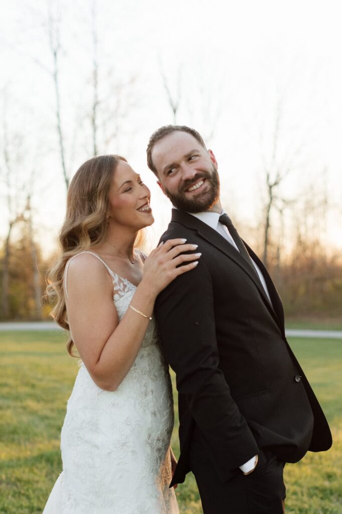 couple smiling at each other during golden hour photos at spring nashville wedding