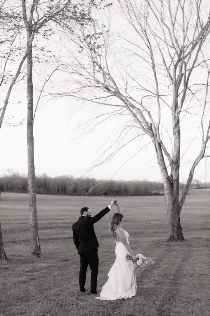 couple dancing in the fields at their spring wedding in nashville