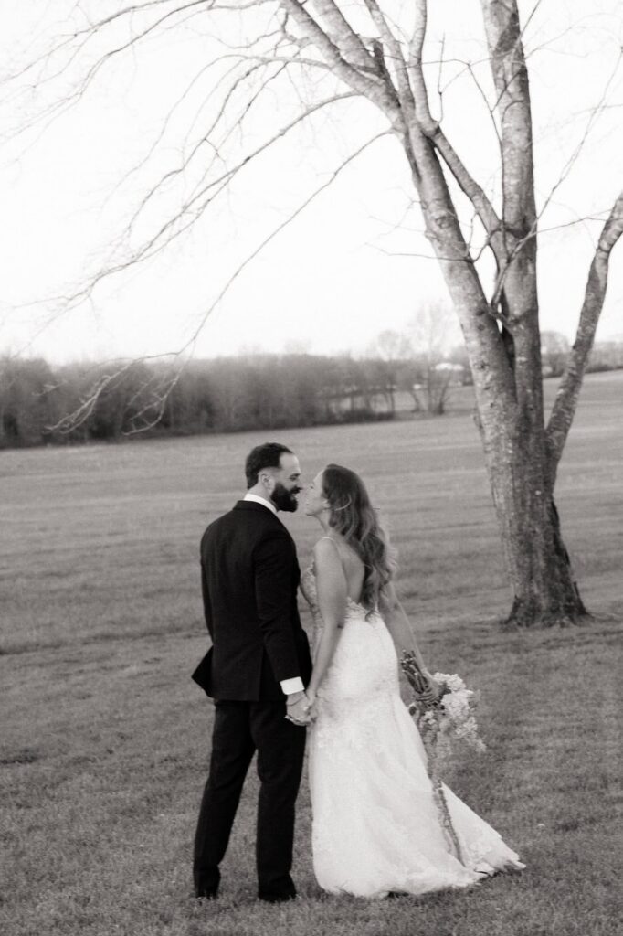 couple holding hands during newlywed photos on their wedding day