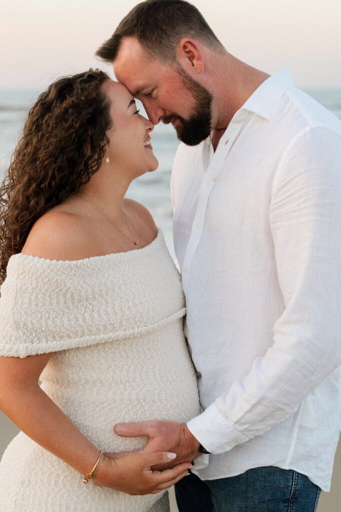 intimate moment of couple during maternity photos